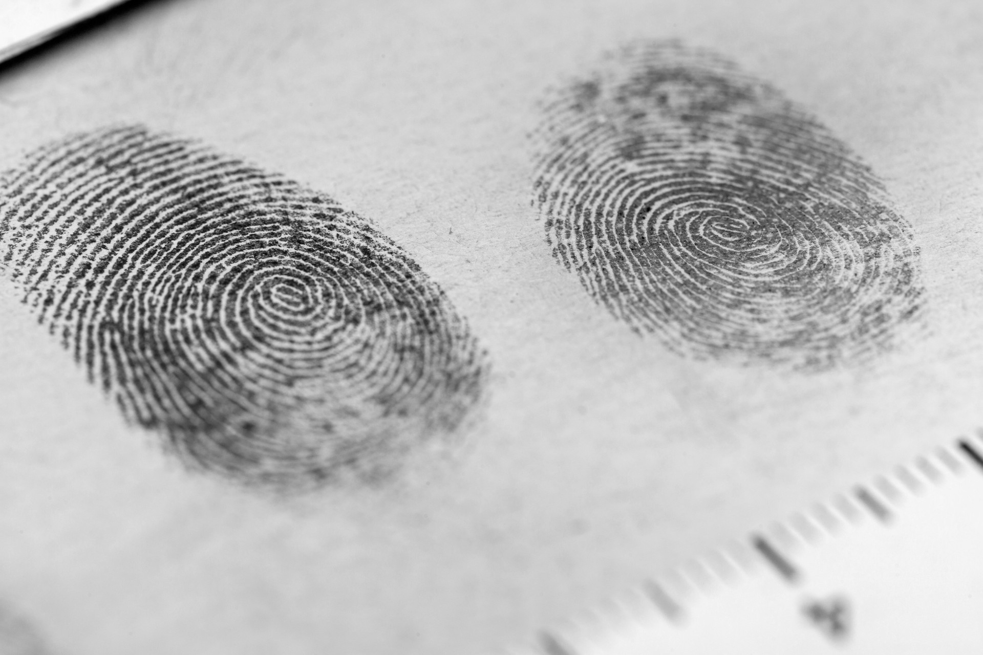 Technician rolling fingerprints on FD-258 card at EverNine Diagnostics Concord lab
