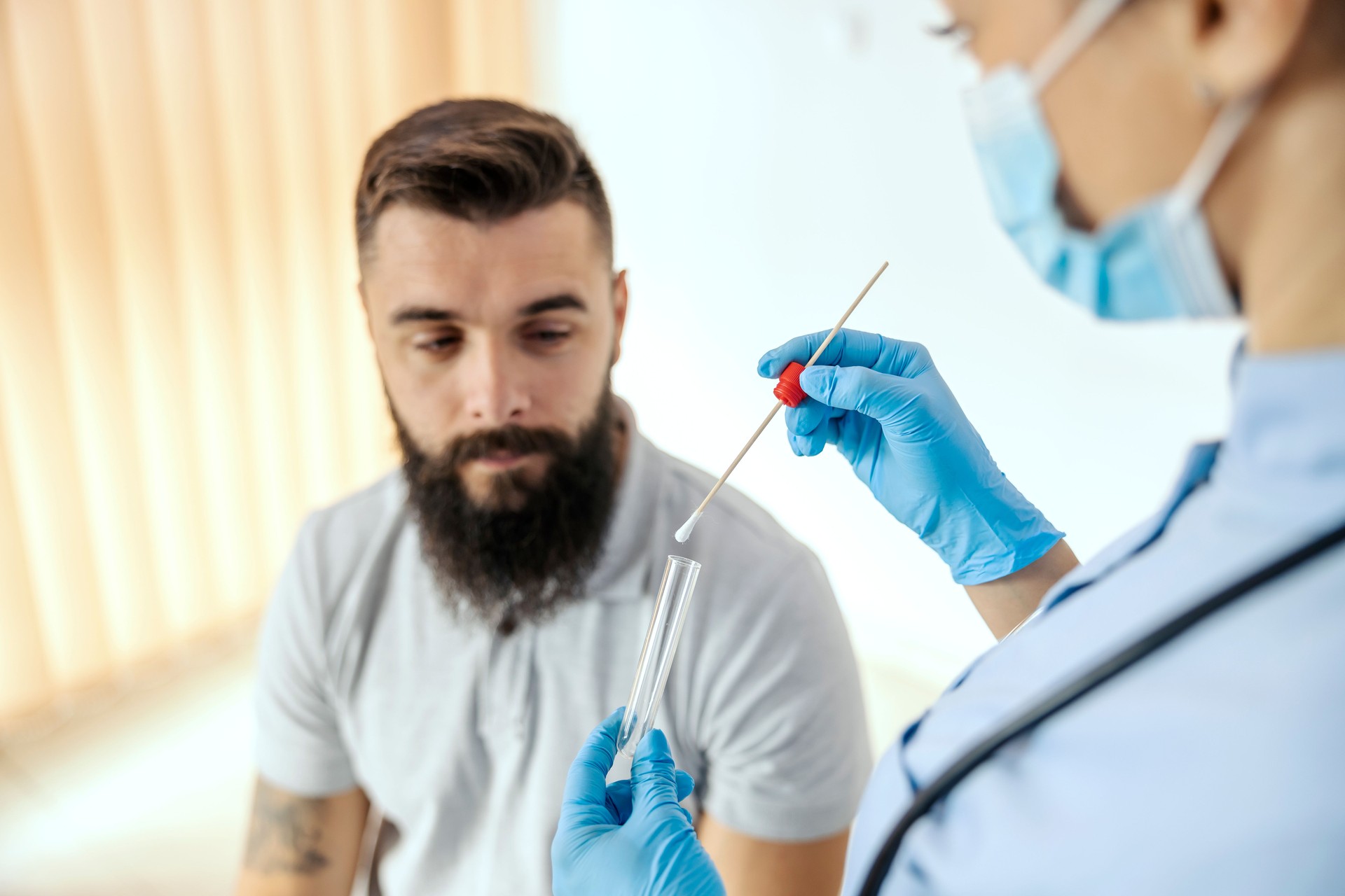 Gloved technician sealing a buccal-swab envelope, previewing EverNine’s upcoming DNA testing service